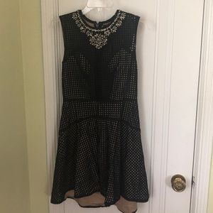 Black and Nude Dress with Embellished neckline.